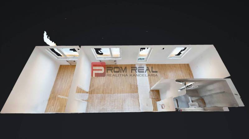 2-room apartment with wooden flooring, white walls, and a bathroom.