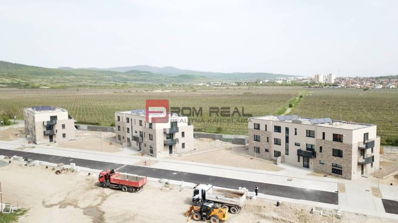 Apartment building construction with vineyards on Limbašská Road in Pezinok, offering 2-bedroom apartments.