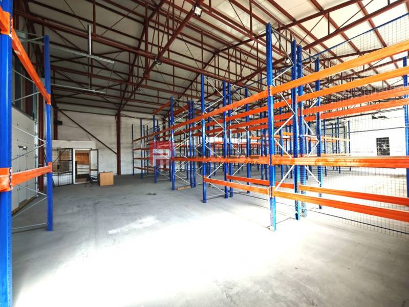 A space with storage racks inside a hall in Modra on Šúrska.