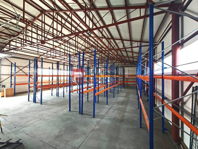 In warehouses and halls, steel shelves and concrete floors are visible.