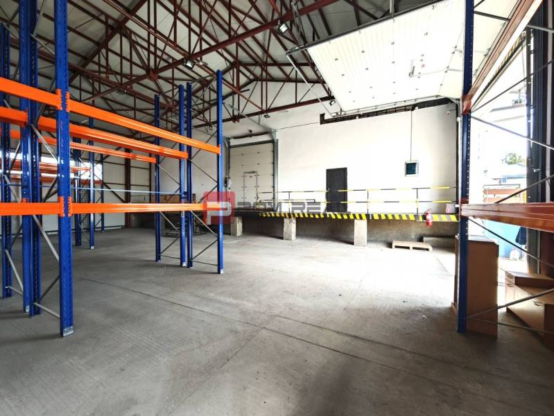 Warehouses and halls with shelves and a loading ramp.