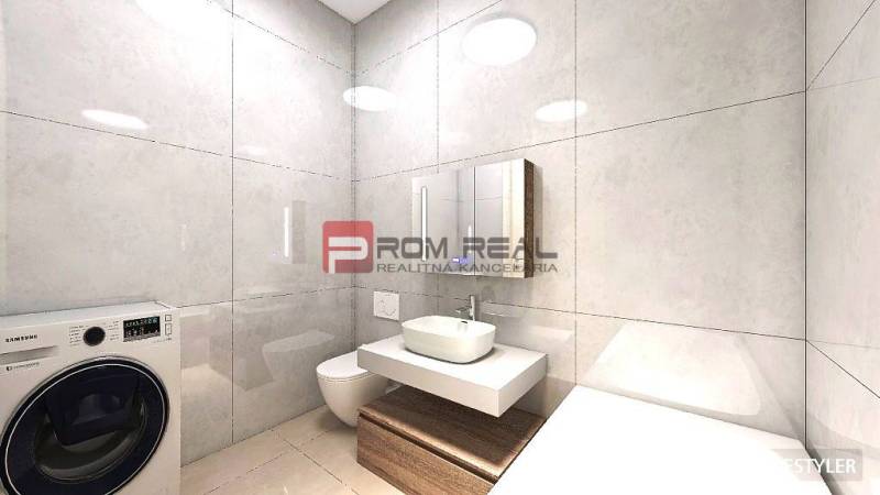 Bathroom with a washing machine, sink, toilet, and mirror in a studio apartment.