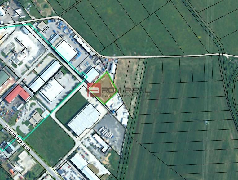Aerial view of the production facilities in Pezinok surrounded by agricultural landscape.