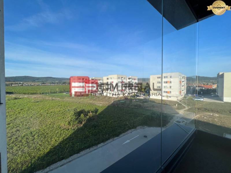 View from a 4-room apartment on Obchodná Street in Pezinok of the surroundings and buildings.
