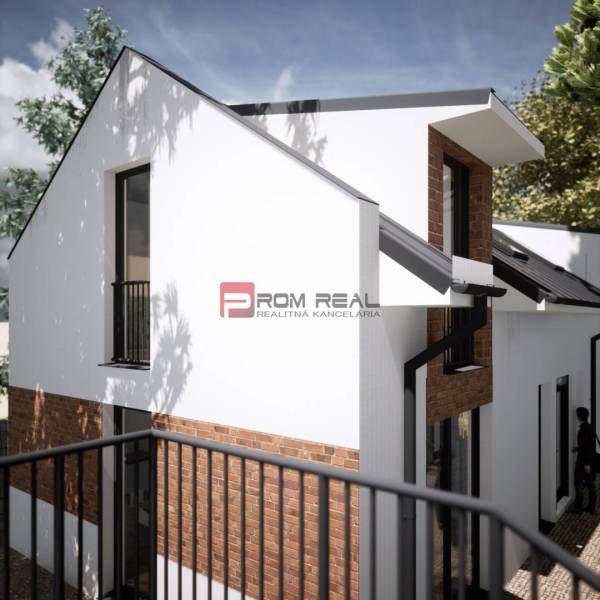 White facade and red brick details of the building on Holubyho Street in Pezinok suitable for Residential Land.