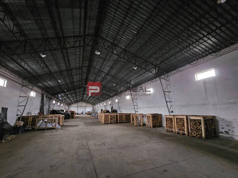 Space on Partizánska Street, designated for warehouses and halls, with stored pallets.