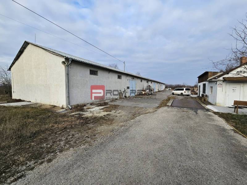 On Partizánska Street, warehouses and halls are visible next to the road.