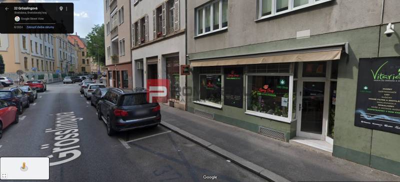 Grösslingova Street in Bratislava with parked cars and commercial spaces.