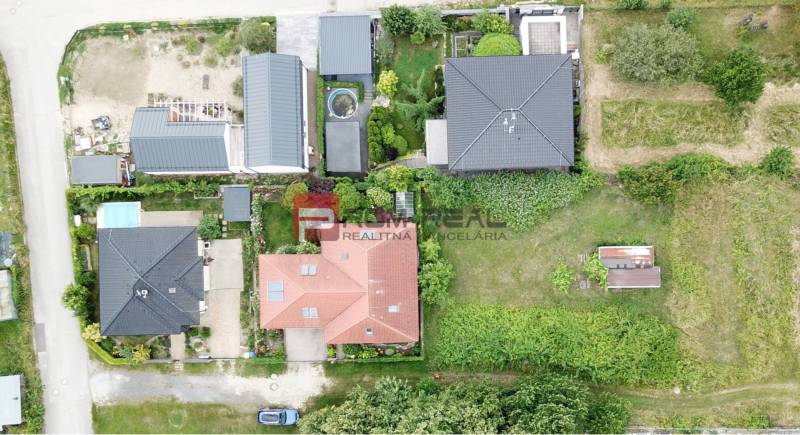 Aerial view of plots - housing in Marianka on Na Tálkoch street, with gardens and buildings.