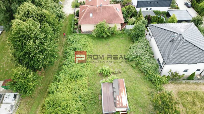 Aerial view of gardens and buildings on Na Tálkoch Street in Marianka, Residential plots.