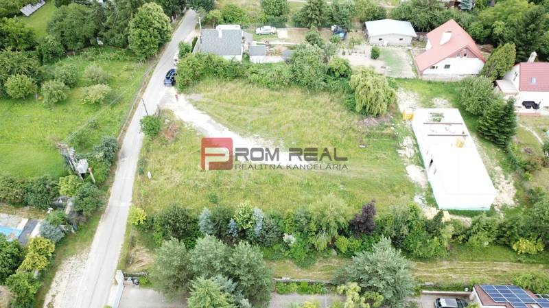 Lucrative residential plots on Štúrova Street in Marianka, surrounded by greenery and houses.