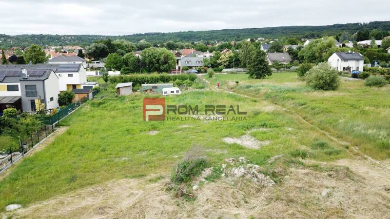Marianka, Na Ovsisku: Land - housing with a view of the surrounding houses and greenery.