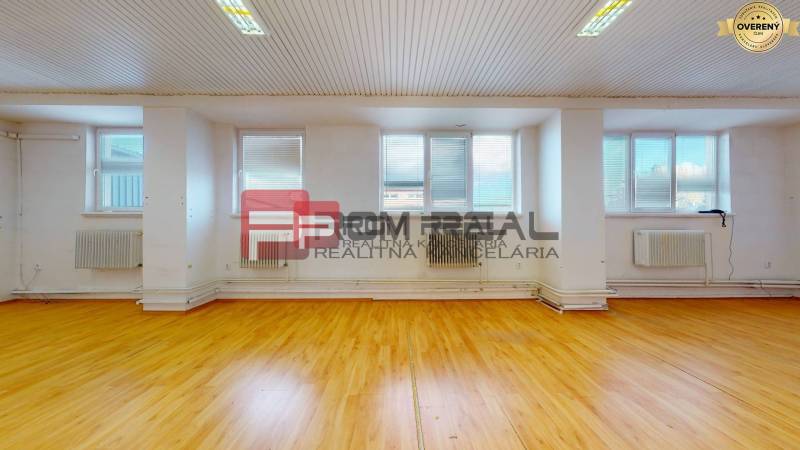 Warehouses and halls with wooden floors, white walls, and windows with blinds.