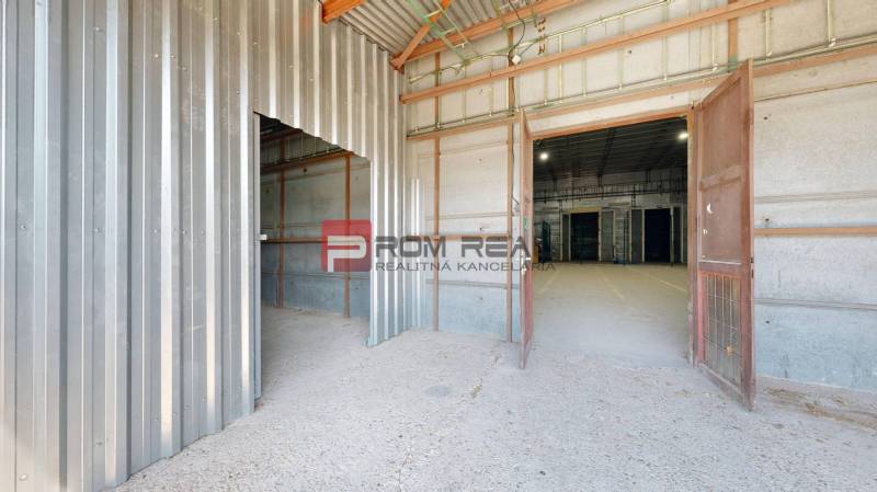 An interior view of industrial spaces, warehouses, and halls with metal walls and flooring.