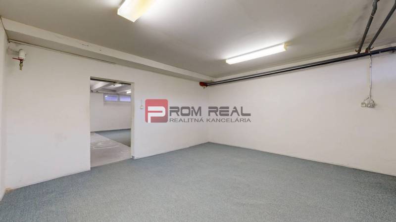 Interiors of warehouses and halls with carpet and white walls.