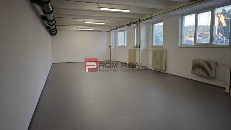 Interior of a warehouse with white walls, windows, and lights, Warehouses and halls.