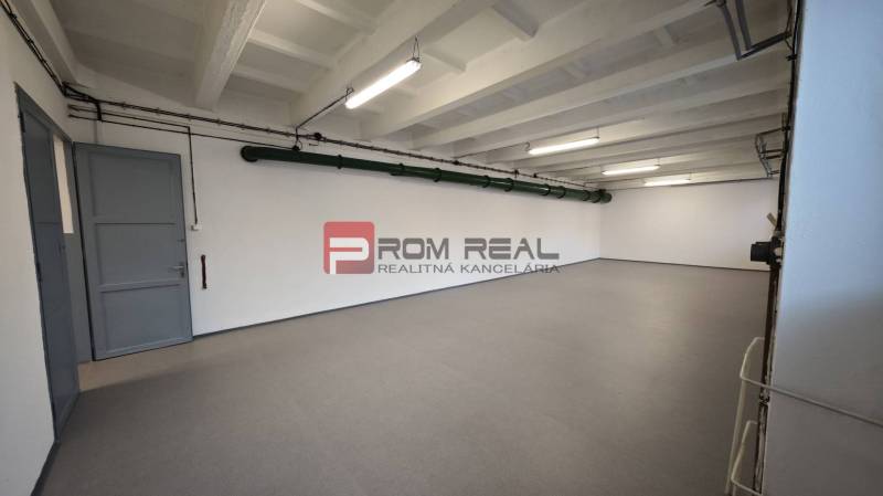 Interior from the Warehouses and Halls section with a spacious room, white walls, and lighting.