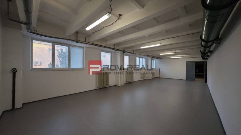 The interior of a warehouse and hall with white walls and floor.