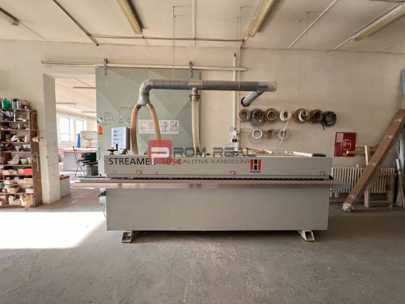 Production premises with woodworking machinery and tools, suitable for carpentry production.