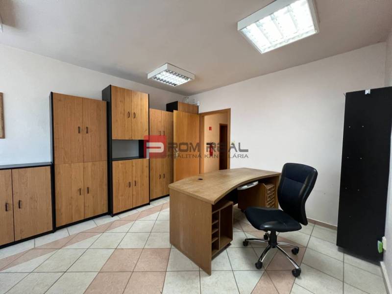 Office in production premises with furniture and a work desk.