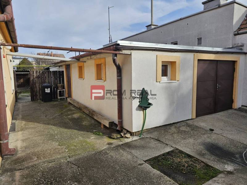 Garage at a family house on Slnečná Street in Pezinok with an access walkway.