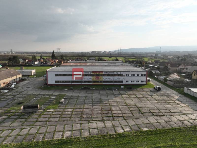 Production premises on Pezinská Street in Vinosady surrounded by green areas and roads.