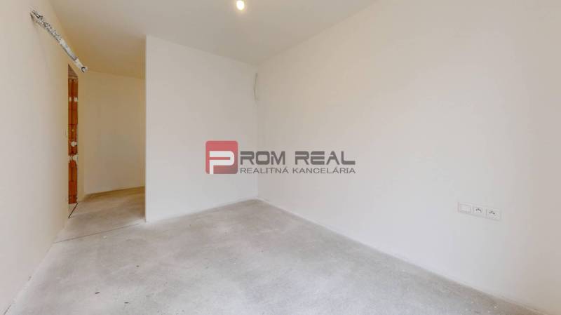 Empty room in a family house, white walls, floor without furniture.