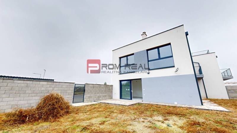 A family house on Bottova Street in Miloslavov with a landscaped plot and fencing.
