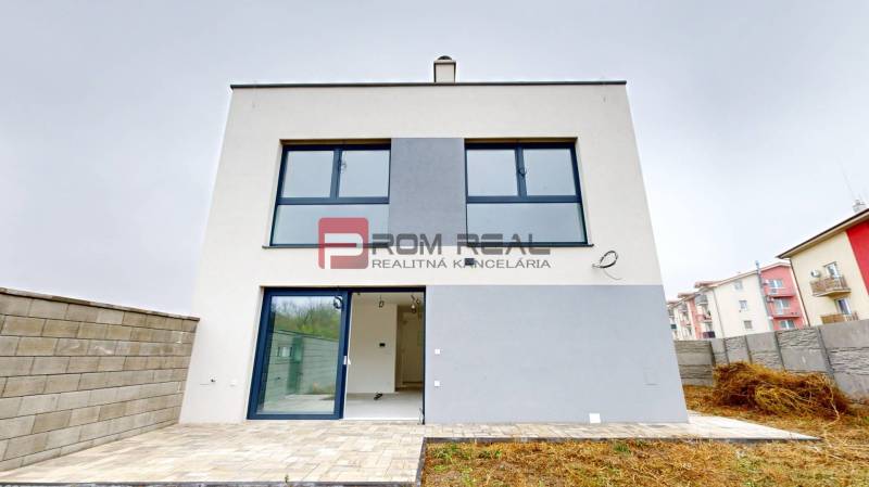 A family house in Miloslavov on Bottova Street with large glass windows and a terrace.