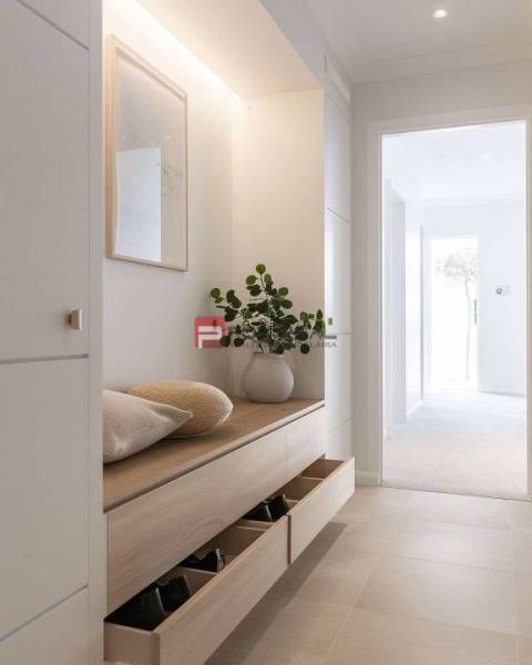 Entrance hallway with wooden furniture, a vase, and shelves, ideal for a holiday apartment.