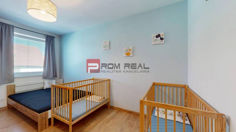 Children's room with a bed, cribs, and decorations in a 3-room apartment.