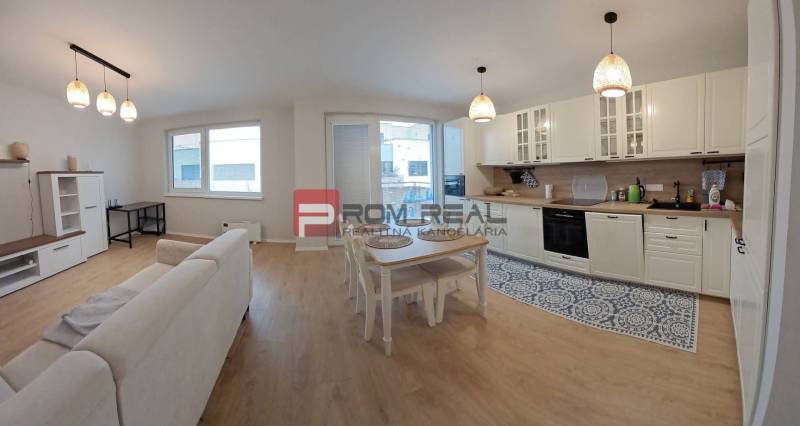 Kitchen with dining area and living room. Spacious studio apartment with a modern kitchen.
