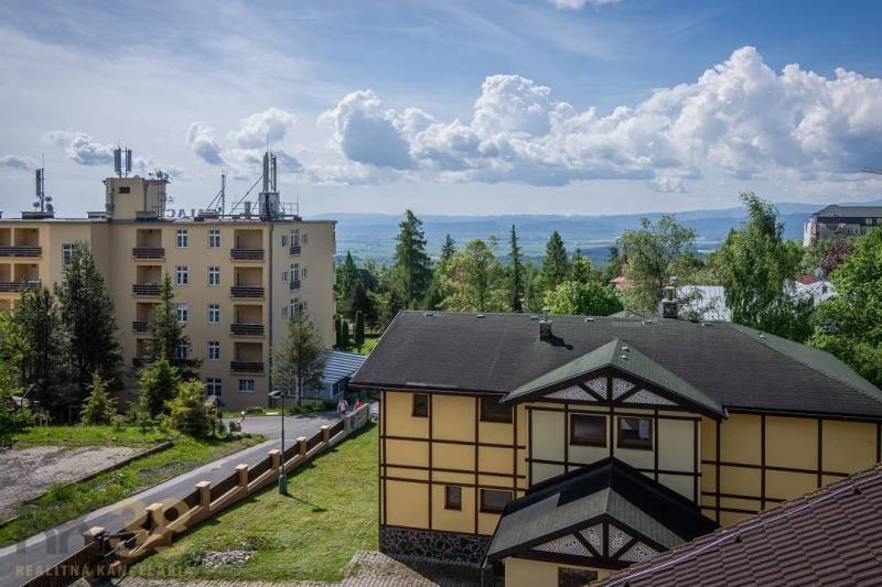 Buildings in the beautiful surroundings of the High Tatras, a recreational apartment surrounded by greenery and mountains.