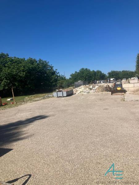 A construction site with containers and construction waste on commercial land on Popradská in Bratislava - Podunajské Biskupice.