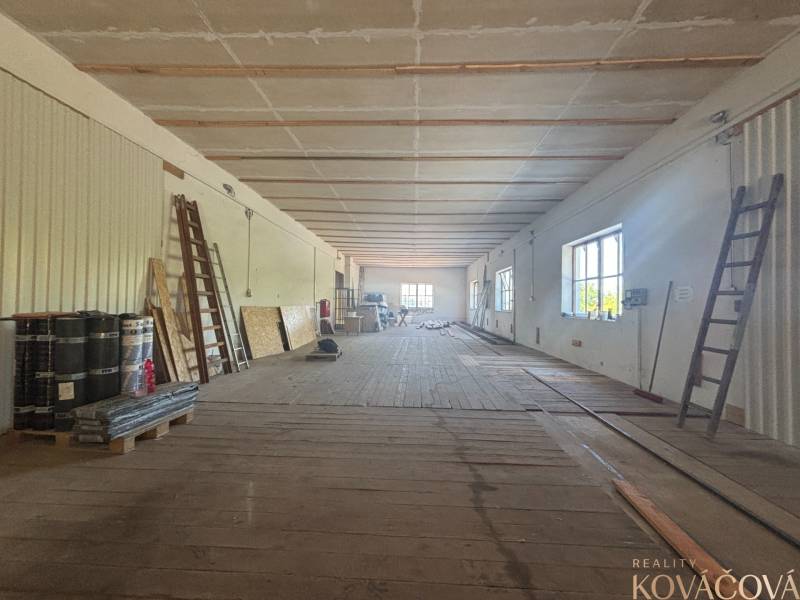 Interior of a warehouse hall with ladders and building materials, warehouses and halls suitable for work.