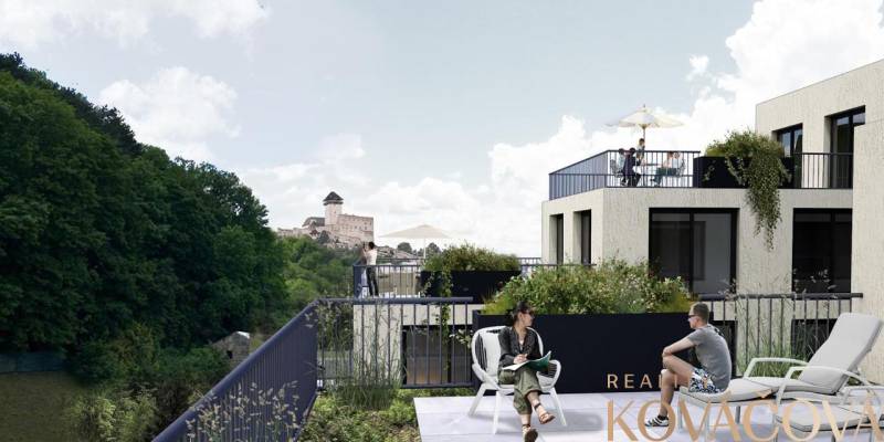Apartment construction on M.R. Štefánika in Trenčín with a view of the castle and greenery.