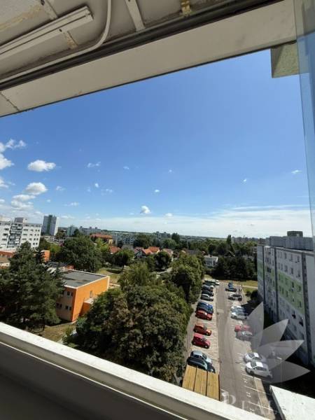View of the parking lot and surroundings from a 2-room apartment on Bučinová Street, Bratislava - Vrakuňa.