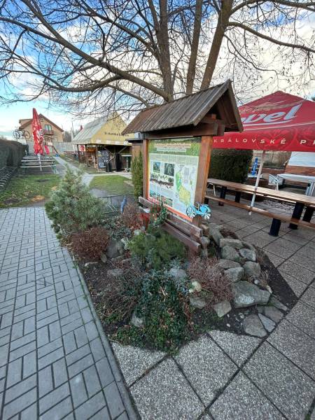 Information board and tables in the gastro area at Devínske Jazero in Bratislava.