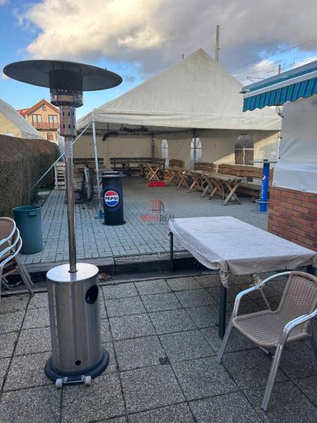 Exterior of gastro premises in Devínska Nová Ves on Devínske Jazero Street with a terrace.