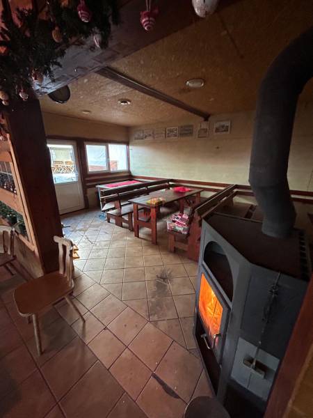 Cozy interior restaurant with a fireplace and wooden furniture, gastro spaces.