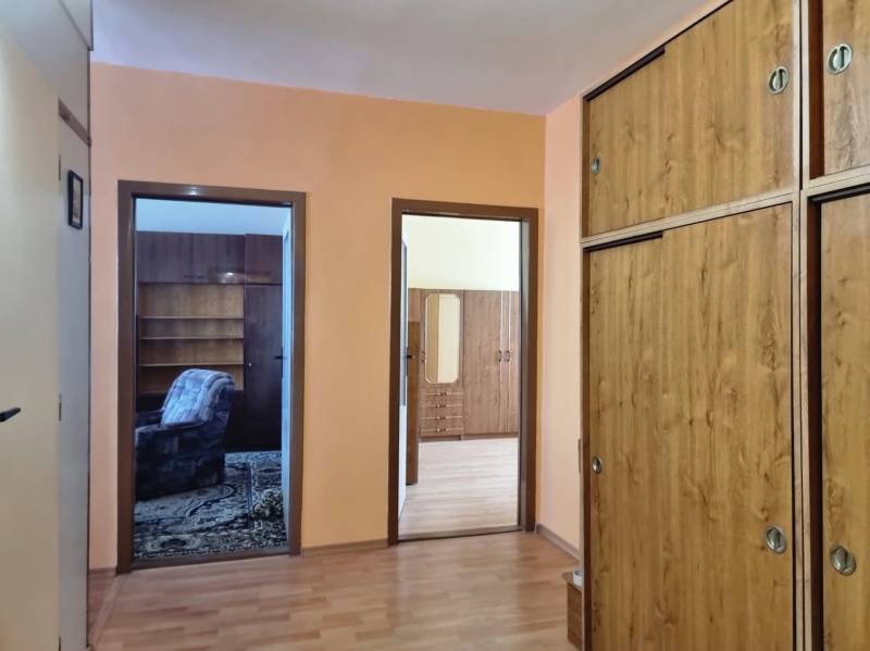 In the 2-room apartment, there is a hallway with storage closets and access to the rooms.
