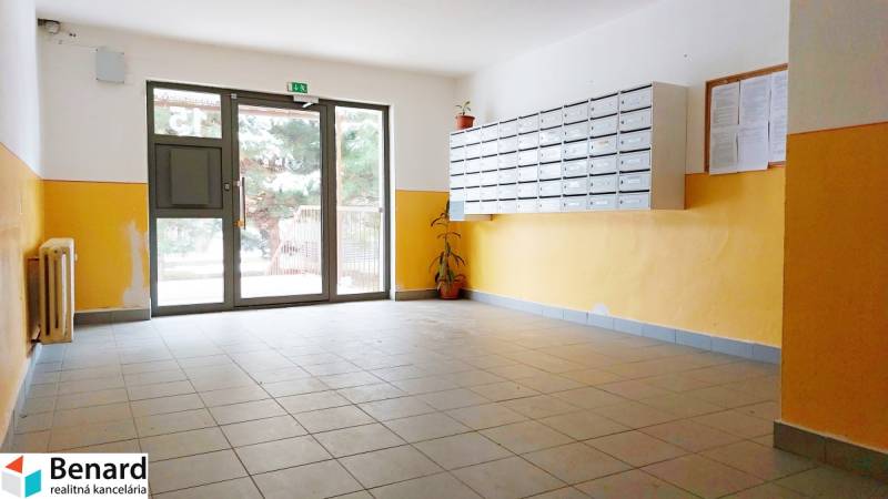 Lobby with mailboxes and glass doors, suitable for a 1-bedroom apartment.