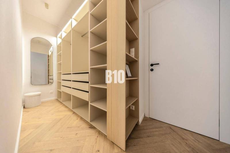 The picture shows a spacious wardrobe in a 3-room apartment on Benediktiho Street.