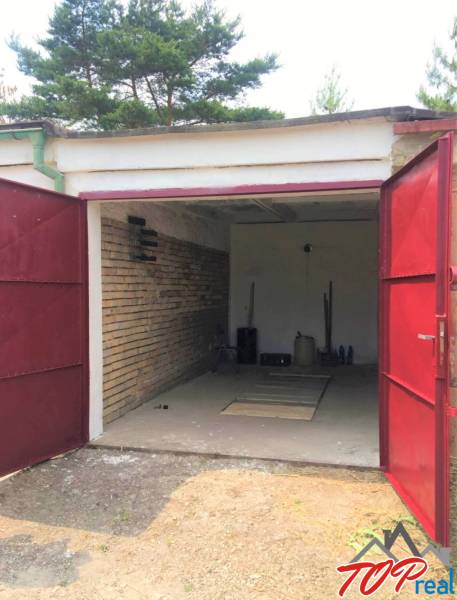 An open garage on Michalovská Street in the Západ district of Košice.