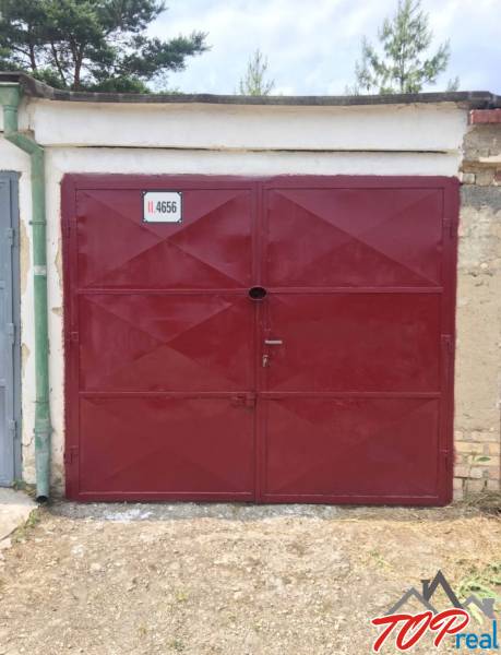 Red garage door on Michalovská Street, Košice - Západ district.