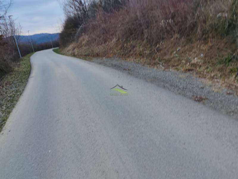 Road to Recreational Lands in Holčíkovce, Eva Street, surrounded by nature and hills.