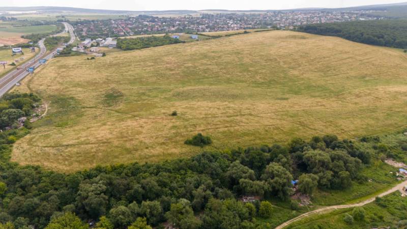 Fields and forest in Košice - Luník IX district, neighboring roads are also visible.