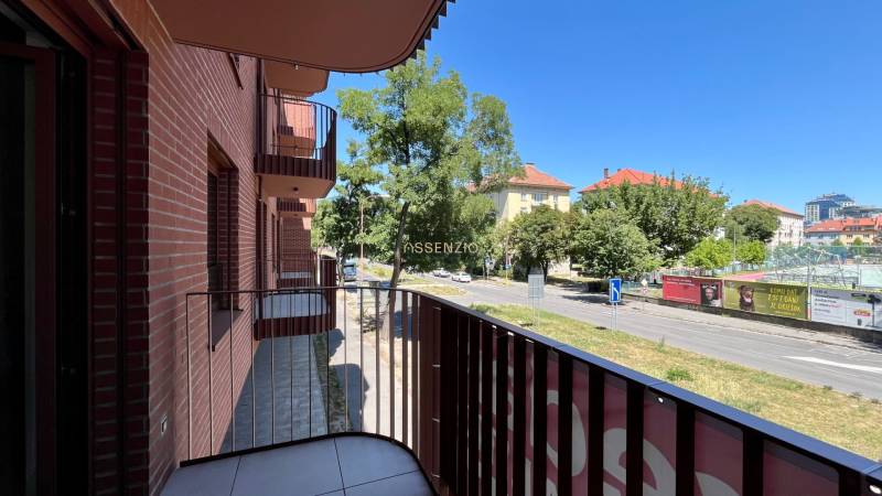 The balcony of an apartment on Cvernovka Street in Bratislava - Ružinov with greenery and a road.