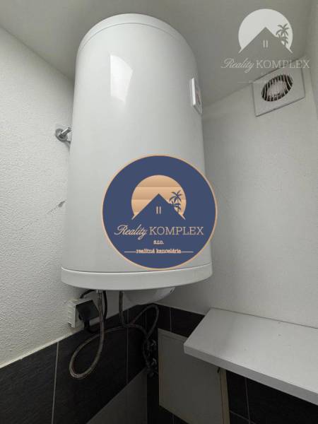 Electric boiler in the bathroom of a one-room apartment showing installation details.