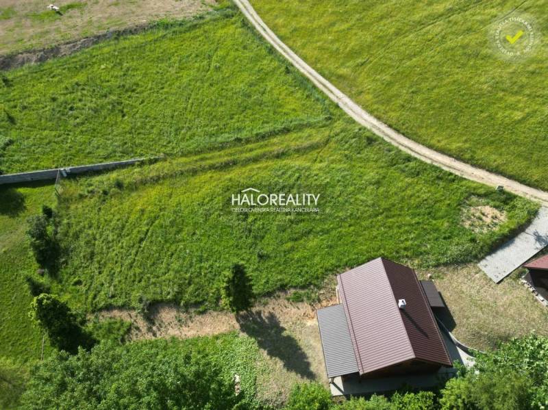 Aerial view of Recreational plots in Vyšné Ružbachy with green meadows and a house.